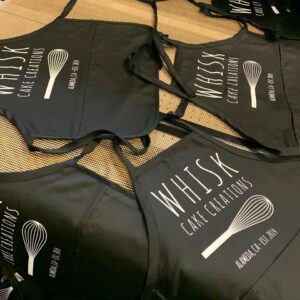 Whisk Cake Creations black aprons