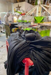Black shirts on factory table